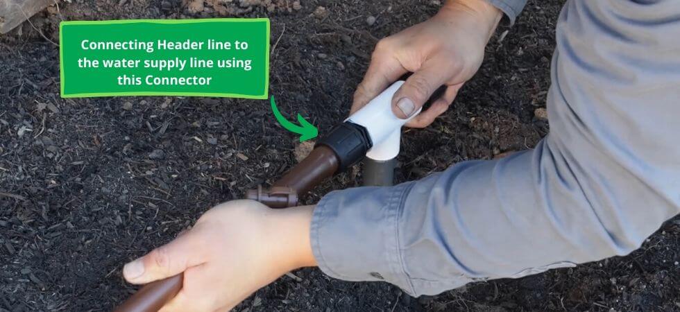 installing the header line of the drip irrigation system DIY Greenhouse drip Igrriation system