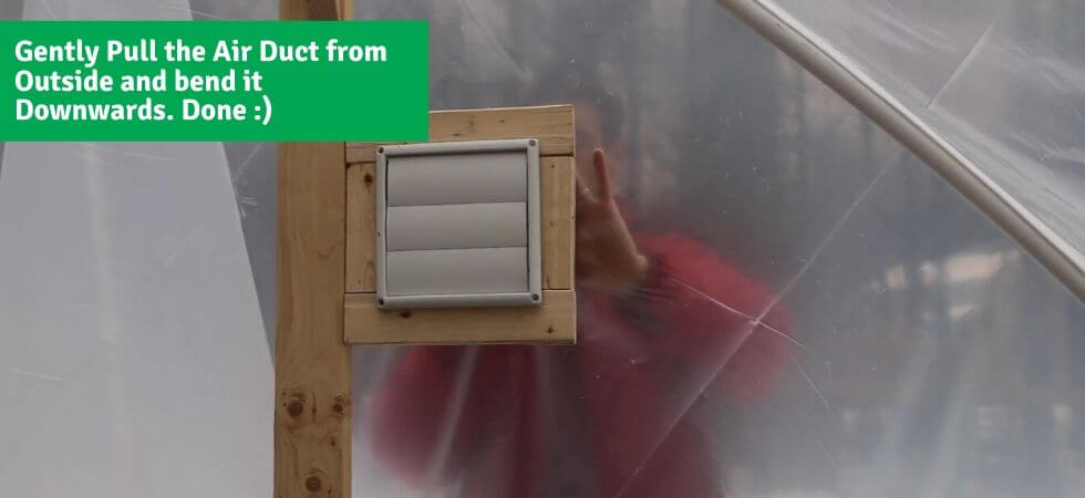 pulling the air duct and bending it downwards DIY Greenhouse Ventilation System